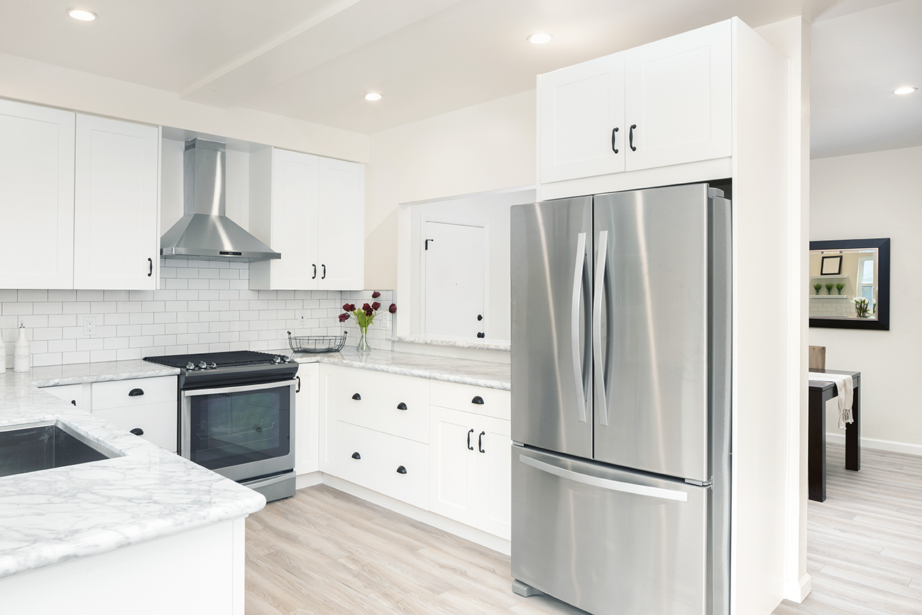 Bright, fresh kitchen with white cabinets and a spacious island